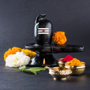 Shiva Linga decorated with flowers & bel patra or leaf and haldi kumkum for Pooja or worshipping of Lord shiva or Shankar bhagwan
